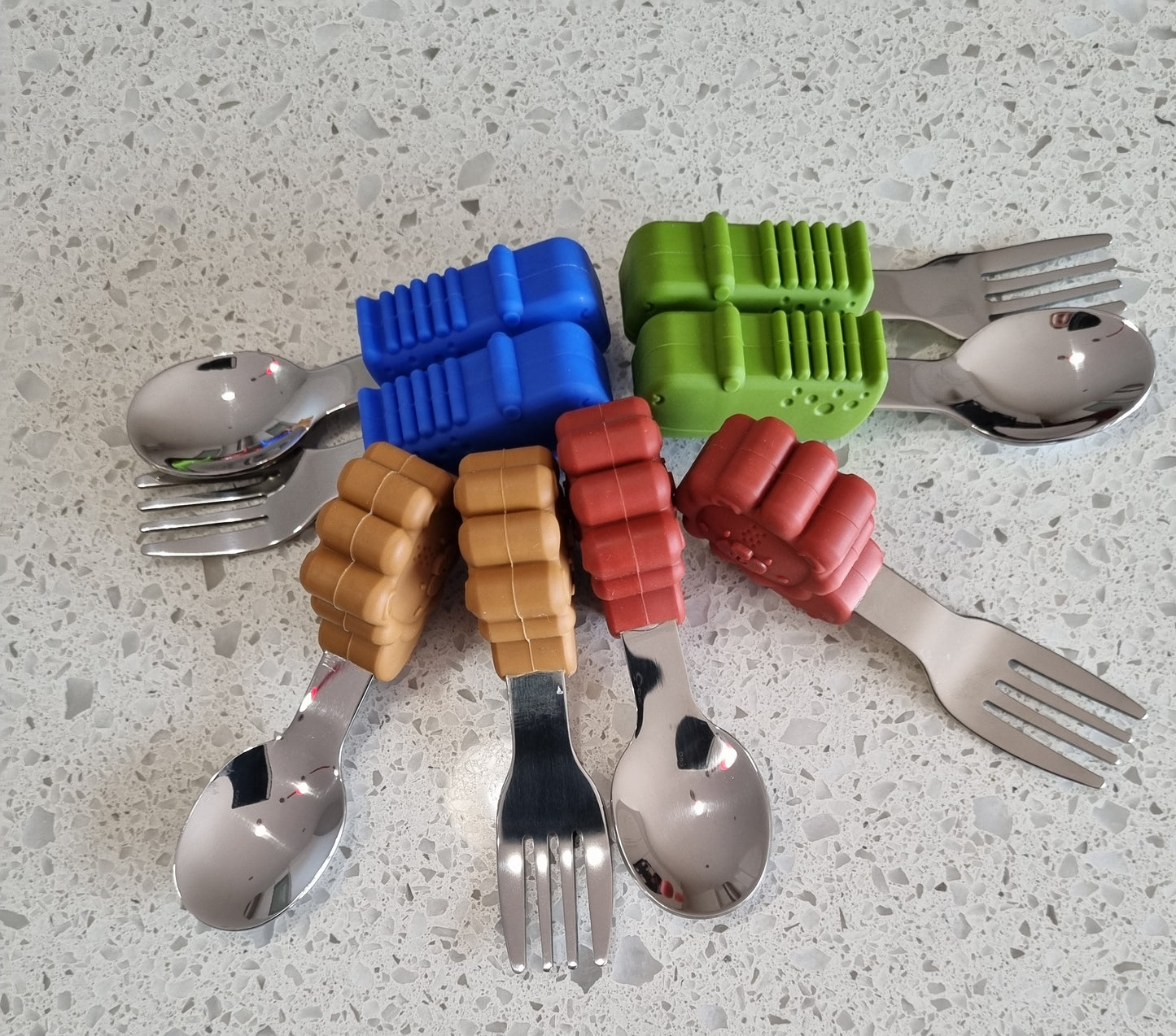 Meal time babies first palm grasp fork and spoon