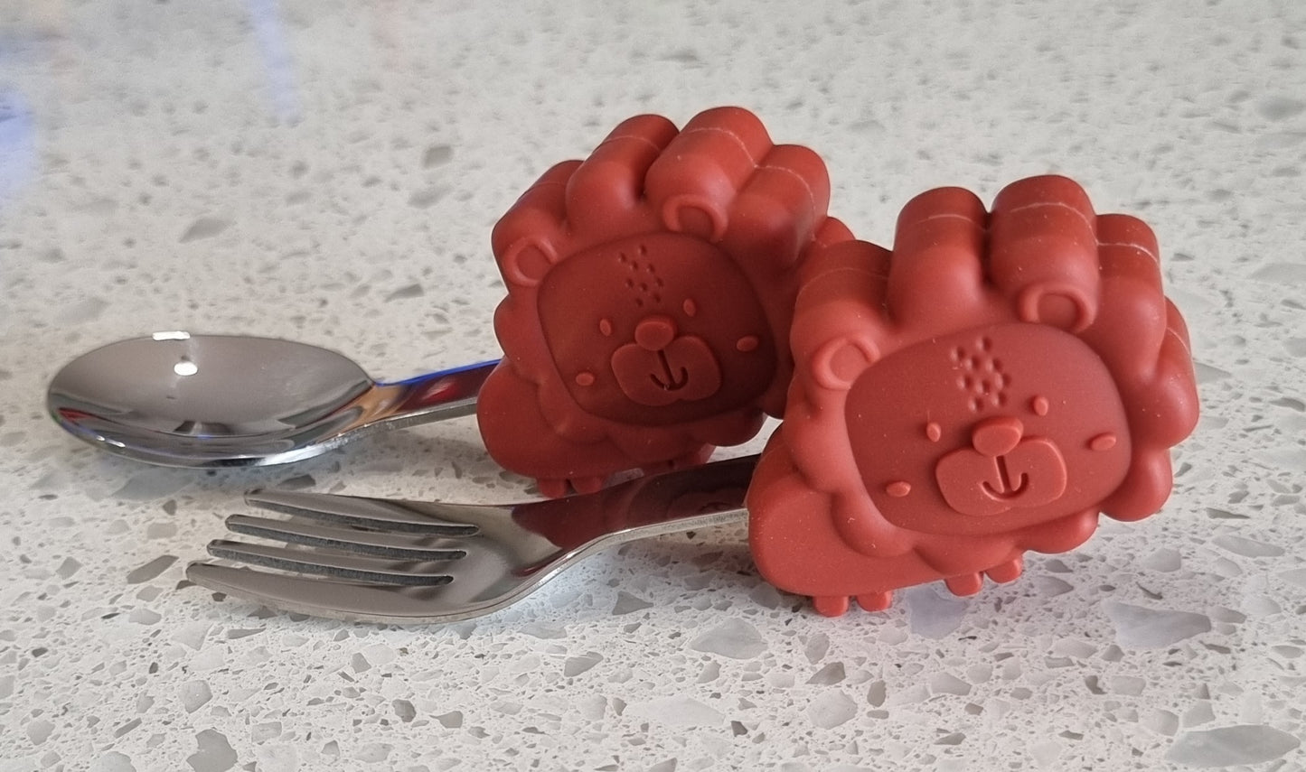 Meal time babies first palm grasp fork and spoon