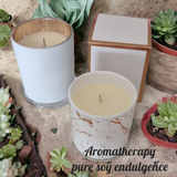 Aromatherapy candle in marbled tumbler with lid.