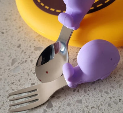 Meal time babies first palm grasp fork and spoon